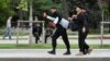 Almaty, Kazakhstan - Law enforcement officers detain a participant during an opposition rally held by critics of Kazakh President Kassym-Jomart Tokayev, who protest over his election in Almaty, Kazakhstan June 12, 2019. REUTERS/Mariya Gordeyeva