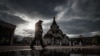 RUSSIA -- A policeman wearing a protective mask patrols a street near Orthodox church during pandemic of SARS-CoV-2 coronavirus in Moscow, October 26, 2020