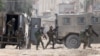 Israeli soldiers operate during a raid in the Nur Shams camp for Palestinian refugees near the city of Tulkarem in the Israeli-occupied West Bank on August 28, 2024.