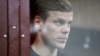 RUSSIA -- Russian soccer player Aleksandr Kokorin, who was detained and accused of carrying out attacks, stands inside a defendants' cage during a court hearing in Moscow, October 11, 2018